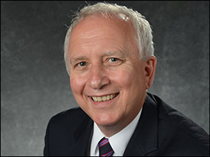 Cognitive behavioralist who uses EHR, Dr. Kevin D. Arnold smiles