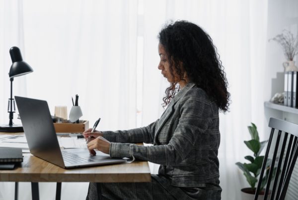 payroll worker at desk