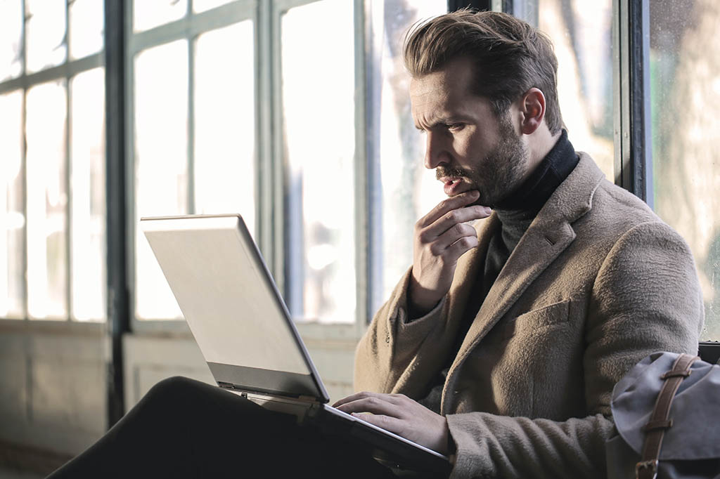 PDMP - Prescription Drug Monitoring Program - concerned looking man looking at laptop