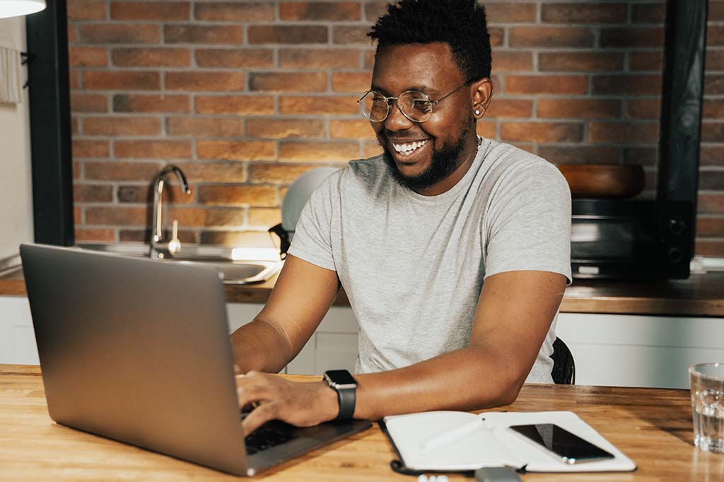 man scheduling appointment on laptop