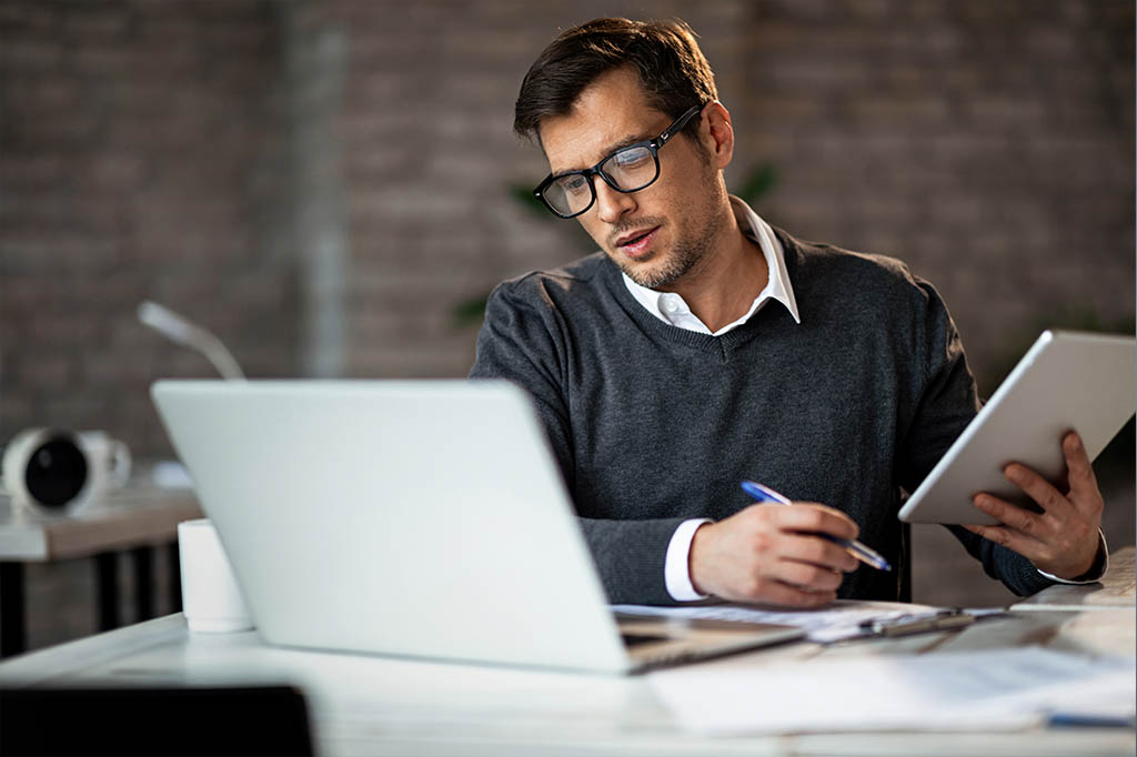 man reviewing eLabs on laptop