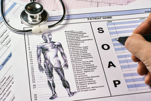 clinician filling out SOAP notes for mental health therapy