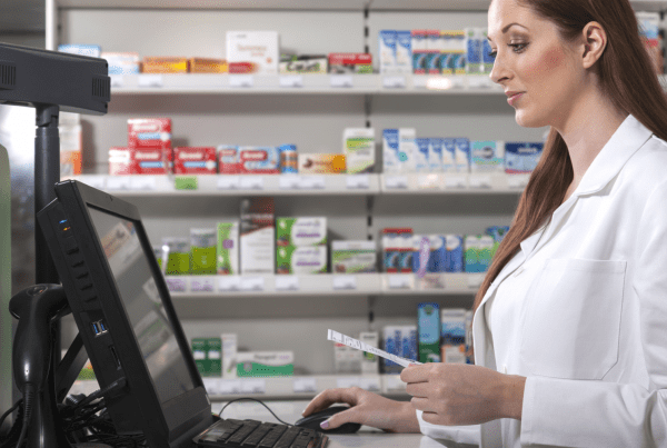 What Is a PDMP? - Pharmacist works with a PDMP database