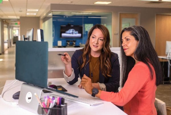 women working at desk in office