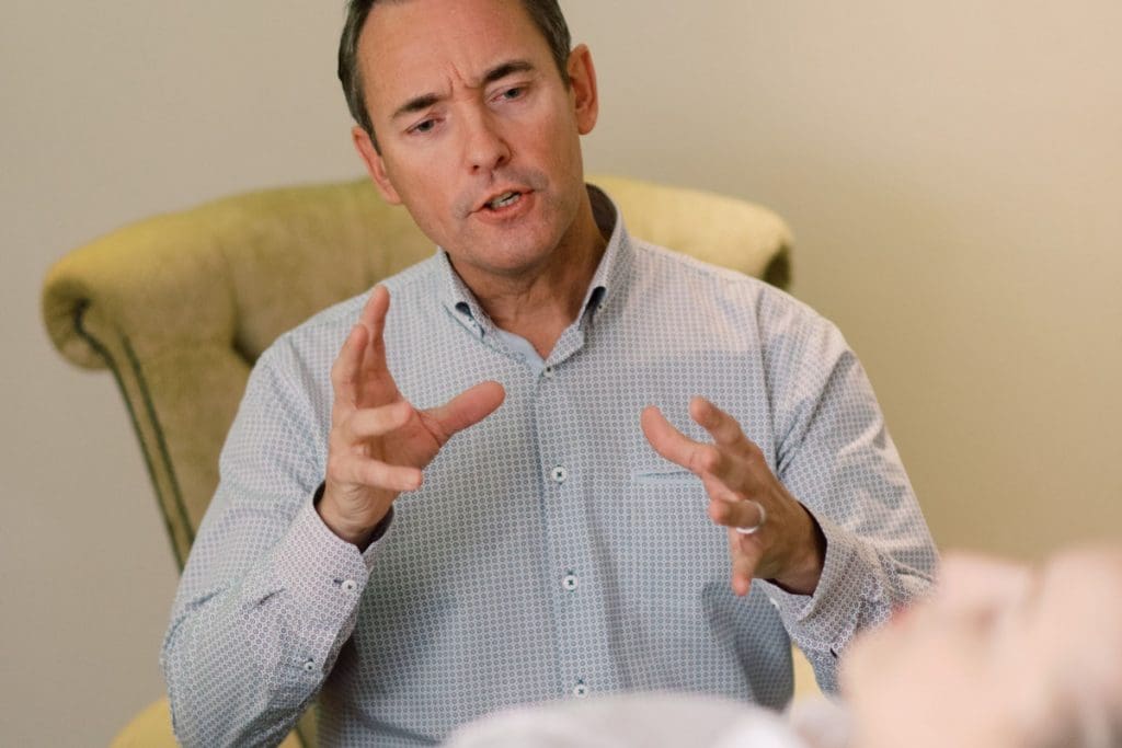 psychiatrist speaking with patient