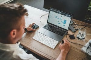 man using computer on desk