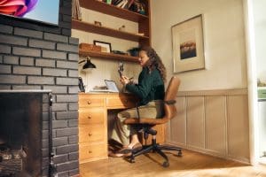 woman making phone call at home office