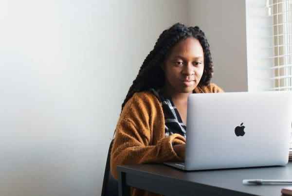 woman using computer on desk