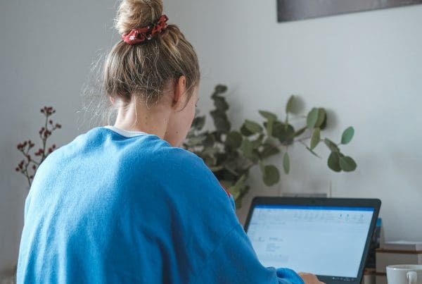 woman working at laptop on desk