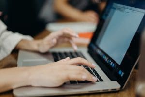 person typing on laptop 2