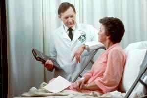 doctor talking to patient in hospital